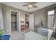 Home office featuring a glass desk, carpet flooring, closet, and grey colored walls at 9921 Rams Leap Ave, Las Vegas, NV 89166
