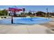 Community splash pad featuring shaded seating, water features, and an adjacent playground at 9921 Rams Leap Ave, Las Vegas, NV 89166