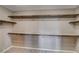 Walk-in closet with carpet flooring, and shelving on all sides for storage at 9921 Rams Leap Ave, Las Vegas, NV 89166