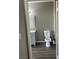 Bathroom with a gray vanity, gray walls, and dark wood floors viewed from the doorway at , Las Vegas, NV 89148