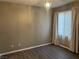 This bedroom has wood flooring, a chandelier and a window with light filtering shades at , Las Vegas, NV 89148