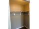 This walk in closet has gray walls, white trim and a rod for hanging clothes at , Las Vegas, NV 89148