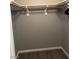 This walk in closet has gray walls, white trim and a rod for hanging clothes at , Las Vegas, NV 89148