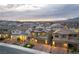 Areal view of homes and rooftops in a planned residential neighborhood, and mountain backdrop at 10372 Thurso Ave, Las Vegas, NV 89166