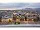 An aerial perspective of neighborhood homes, illustrating a thriving community with mountain views at 10372 Thurso Ave, Las Vegas, NV 89166