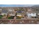 An aerial view of a residential neighborhood, showcasing houses and street layout at 10372 Thurso Ave, Las Vegas, NV 89166