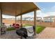 Cozy covered patio with outdoor seating, ideal for entertaining at 10372 Thurso Ave, Las Vegas, NV 89166