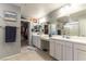 Bright bathroom boasting double sinks, vanity, and walk-in closet access at 10372 Thurso Ave, Las Vegas, NV 89166