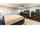 Spacious bedroom with a large bed, ceiling fan, and ample natural light at 10372 Thurso Ave, Las Vegas, NV 89166