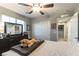 Serene bedroom with a ceiling fan, closet, and dresser at 10372 Thurso Ave, Las Vegas, NV 89166