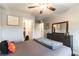 Well-lit bedroom with a full size bed, closet, and dresser at 10372 Thurso Ave, Las Vegas, NV 89166