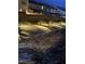 A nighttime photo of a community path with lighting alongside the home at 10372 Thurso Ave, Las Vegas, NV 89166