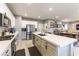 Bright kitchen features a large island with quartz countertop and stainless steel appliances at 10372 Thurso Ave, Las Vegas, NV 89166