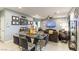 Open-concept living space combining dining and living areas, with modern decor and ample natural light at 10372 Thurso Ave, Las Vegas, NV 89166