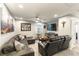 Inviting living room featuring a comfortable sectional sofa and sleek entertainment center at 10372 Thurso Ave, Las Vegas, NV 89166