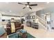 Inviting living room and kitchen area featuring tile flooring and comfortable seating at 10372 Thurso Ave, Las Vegas, NV 89166