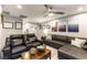 Spacious living room with comfortable seating, ceiling fan, and modern decor at 10372 Thurso Ave, Las Vegas, NV 89166