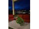 Covered patio with comfortable red seating, perfect for relaxing at 10372 Thurso Ave, Las Vegas, NV 89166