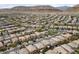 Expansive aerial view of a well-planned residential community nestled against a backdrop of scenic mountains and clear blue skies at 10440 Bay Ginger Ln, Las Vegas, NV 89135