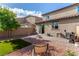 Relaxing backyard features low maintenance landscaping and a covered patio at 105 Pollentia Ave, North Las Vegas, NV 89084