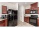 Efficient kitchen featuring wood cabinets and stainless appliances at 105 Pollentia Ave, North Las Vegas, NV 89084