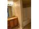 Bathroom with tub, vanity with light wood cabinets and a granite countertop, and vinyl floor at 10550 W Alexander Rd # 2183, Las Vegas, NV 89129