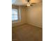 Neutral bedroom with a ceiling fan, window with blinds, and carpeted floors at 10550 W Alexander Rd # 2183, Las Vegas, NV 89129