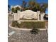 Chateau Versailles neighborhood entrance sign surrounded by landscaping and decorative rocks at 10550 W Alexander Rd # 2183, Las Vegas, NV 89129
