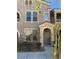Attractive two-story townhome featuring an inviting entrance and neutral stucco at 10550 W Alexander Rd # 2183, Las Vegas, NV 89129