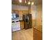 Cozy kitchen featuring stainless steel appliances and wood cabinets at 10550 W Alexander Rd # 2183, Las Vegas, NV 89129