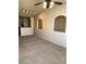 Spacious living room with arched windows and track lighting at 10550 W Alexander Rd # 2183, Las Vegas, NV 89129