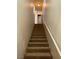 Carpeted staircase with handrail leading upstairs at 10550 W Alexander Rd # 2183, Las Vegas, NV 89129
