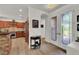 Bright foyer featuring decorative glass doors, a wood floor, and flows into an open kitchen at 10581 Santo Marco Ct, Las Vegas, NV 89135