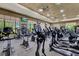 A gym filled with stationary bikes, treadmills and elliptical machines, as well as windows with views to the exterior at 10581 Santo Marco Ct, Las Vegas, NV 89135