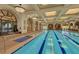 Stunning indoor pool area featuring beautiful architecture, detailed murals and a clear blue swimming pool at 10581 Santo Marco Ct, Las Vegas, NV 89135