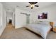 Inviting main bedroom with sliding barn door and neutral decor that creates a relaxing retreat at 10581 Santo Marco Ct, Las Vegas, NV 89135