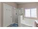 Well-lit bathroom showcasing a combination tub and shower, plus vanity at 10624 Tuckermans Ave, Las Vegas, NV 89129