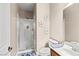 Bright bathroom featuring a glass shower, a toilet, and vanity with stylish fixtures and decor at 10624 Tuckermans Ave, Las Vegas, NV 89129