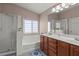 Well-appointed bathroom featuring a soaking tub, walk-in shower, and dual vanity sinks at 10624 Tuckermans Ave, Las Vegas, NV 89129
