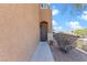 Inviting home entrance with a modern gray door and desert landscaping, complemented by a well-maintained walkway at 10624 Tuckermans Ave, Las Vegas, NV 89129