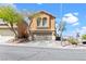 Lovely two-story home featuring a two-car garage and simple desert landscaping, a welcoming Gathering residence at 10624 Tuckermans Ave, Las Vegas, NV 89129