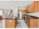 Contemporary kitchen with stainless steel appliances, wooden cabinets, and a center island at 10624 Tuckermans Ave, Las Vegas, NV 89129