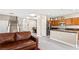 Inviting living room showcases an open floorplan, seamlessly connecting to the modern kitchen and dining area at 10624 Tuckermans Ave, Las Vegas, NV 89129