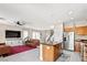 Open concept with a kitchen island, stainless appliances, and seamless flow to living area at 10624 Tuckermans Ave, Las Vegas, NV 89129