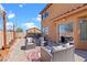Backyard patio featuring comfortable seating, potted plants, and a view of the home, great for outdoor living at 10624 Tuckermans Ave, Las Vegas, NV 89129