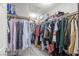 Spacious walk-in closet with custom shelving and ample storage for clothing and accessories at 10624 Tuckermans Ave, Las Vegas, NV 89129