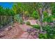 Garden and sitting area featuring decorative plants and a desert landscape at 11037 Clarion Ln, Las Vegas, NV 89134