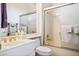 Well-lit bathroom featuring a toilet, marble sink vanity and shower-tub combination at 11037 Clarion Ln, Las Vegas, NV 89134