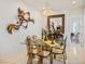 A charming dining room with a chandelier and decorative art piece at 11037 Clarion Ln, Las Vegas, NV 89134