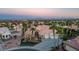 Beautiful home showcasing a manicured front yard, mature palm trees, and a three-car garage, creating a welcoming entrance at 11037 Clarion Ln, Las Vegas, NV 89134